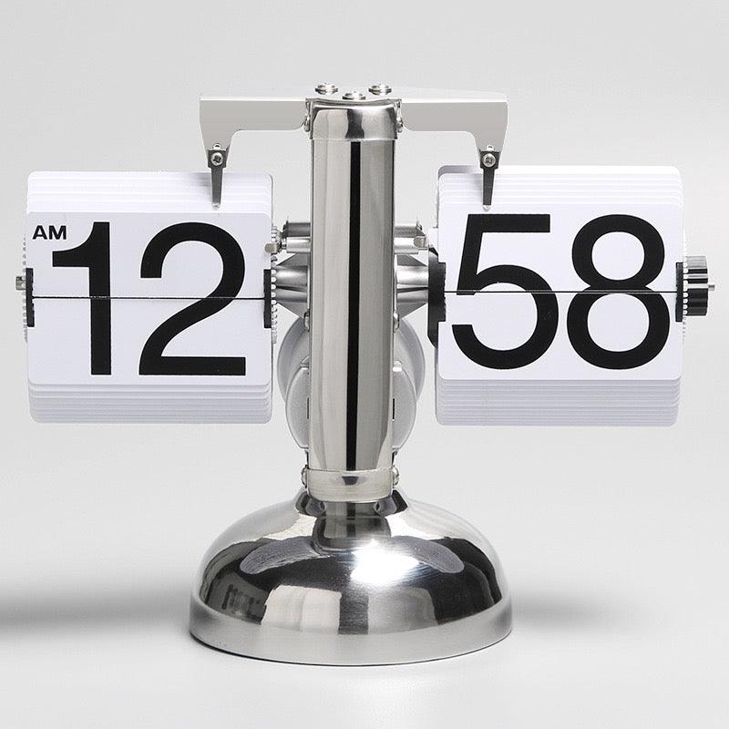 Relógio de mesa com página giratória automática - Rede Canan
